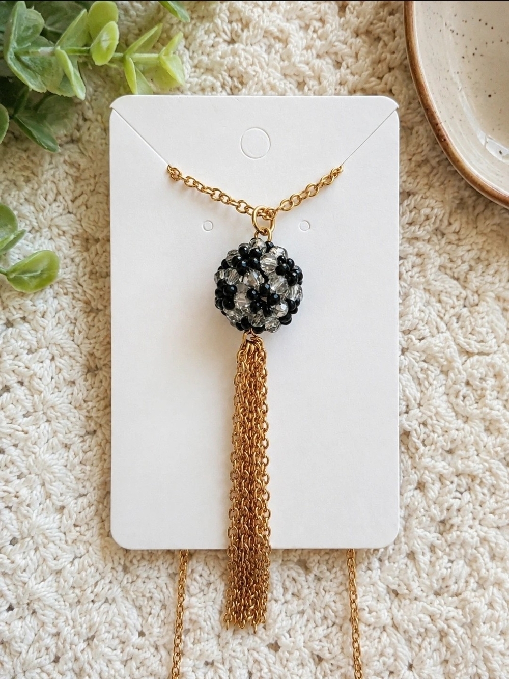 Gold-Tone Necklace with Black and Clear Beaded Orb and Tassel